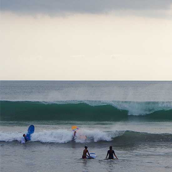 Surfing at Kuta, Bali - World Holiday Vibes
